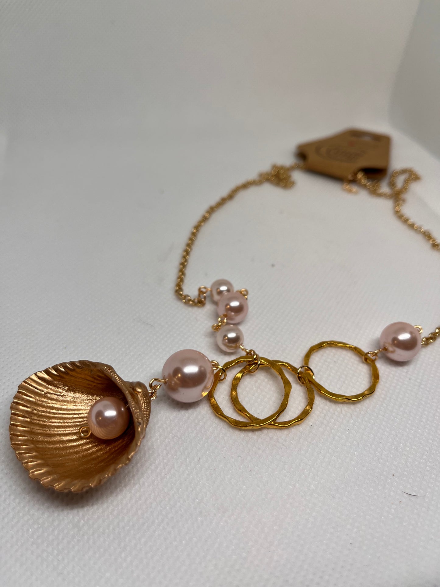 Triple Hammered Gold Circle with Pink Pearl Beads in a Gold Seashell Necklace
