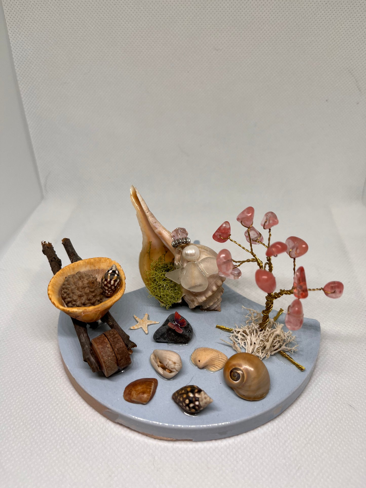 Wheelbarrow on Blue Tile: White Sea Glass Fairy Cottage Conch Shell w/ Watermelon Quartz Tree