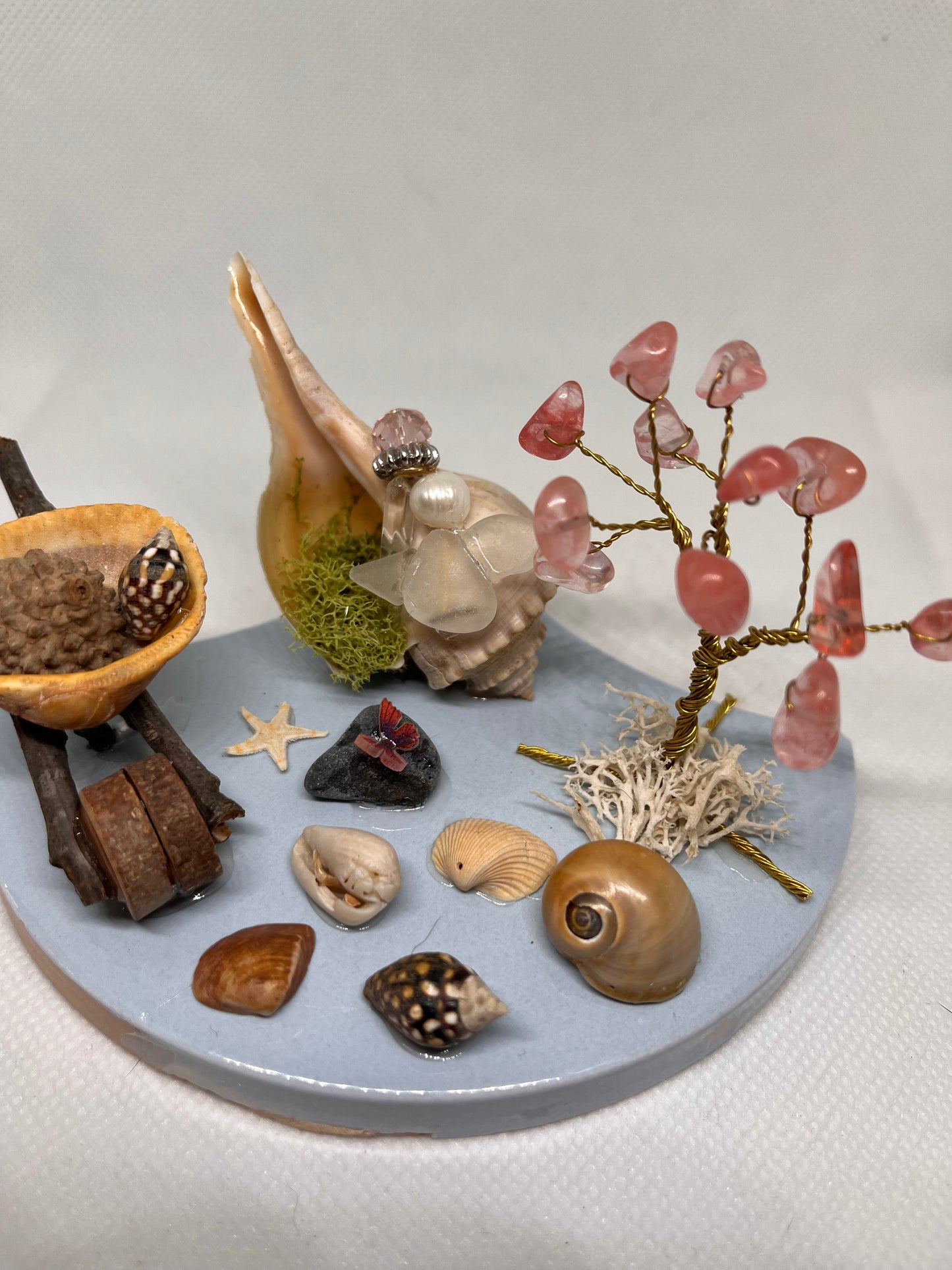 Wheelbarrow on Blue Tile: White Sea Glass Fairy Cottage Conch Shell w/ Watermelon Quartz Tree