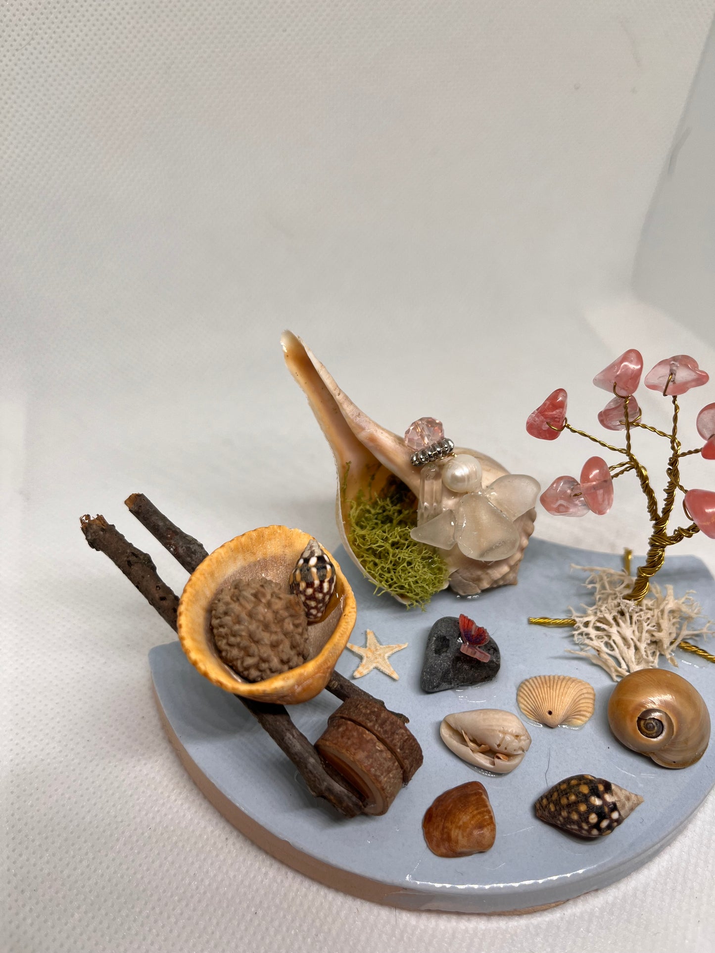 Wheelbarrow on Blue Tile: White Sea Glass Fairy Cottage Conch Shell w/ Watermelon Quartz Tree