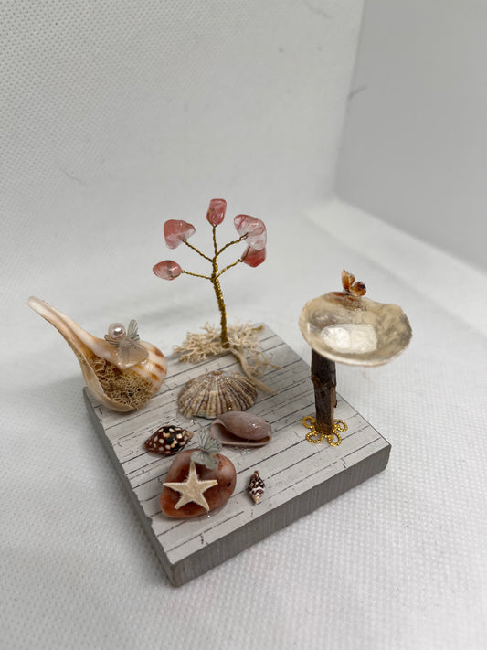 White Sea Glass Fairy Cottage Conch Shell w/ Bird Bath and Watermelon Quartz Tree on Light Tile