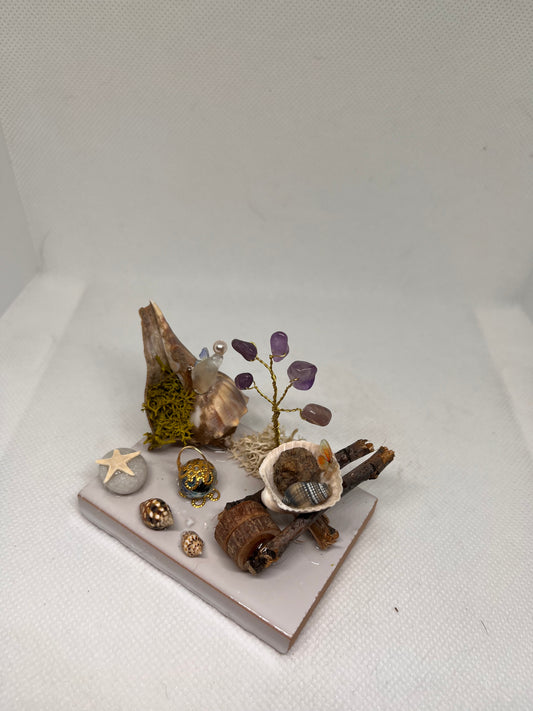 White Sea Glass Fairy Cottage Conch Shell w/ Wheelbarrow, Lantern, and Amethyst Tree on White Tile