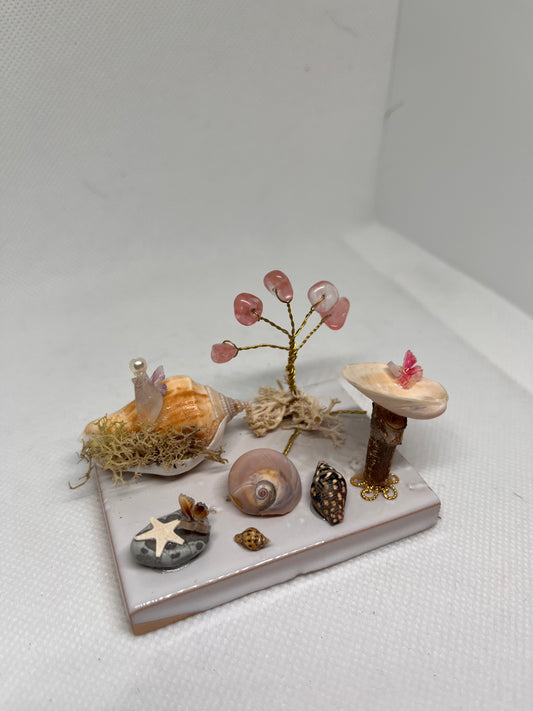 White Sea Glass Fairy Cottage Conch Shell w/ Bird Bath and Watermelon Quartz Tree on White Tile
