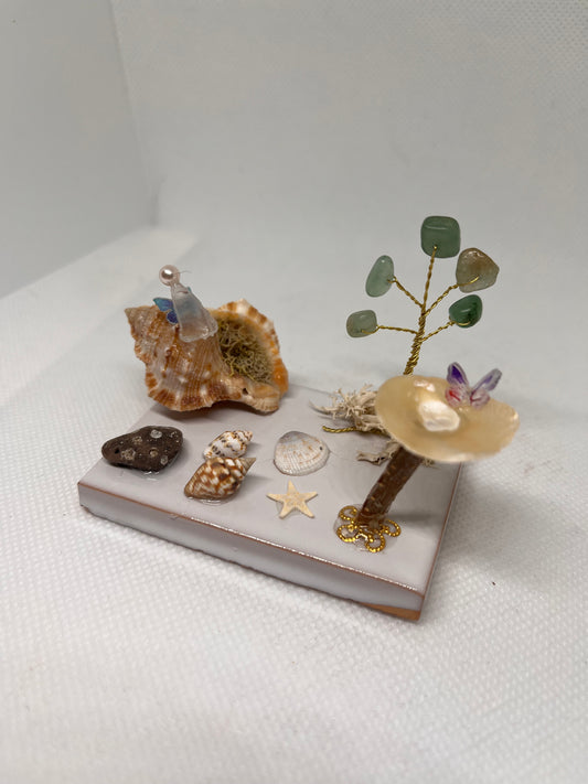 White Sea Glass Fairy Cottage Conch Shell w/ Bird Bath and Aventurine Tree on White Tile