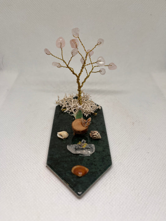Small Green Sea Glass Fairy Cottage Conch Shell w/ Wood Slice Table, Quartz Bench, and Rose Quartz Tree on Green Tile